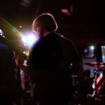 Musician examining music rights agreement before signing a record deal